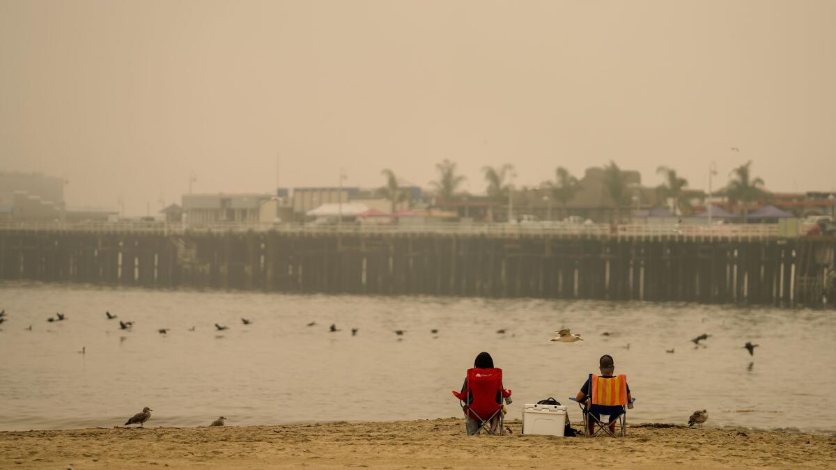 At UC Santa Cruz fire rages nearby as thousands are forced to